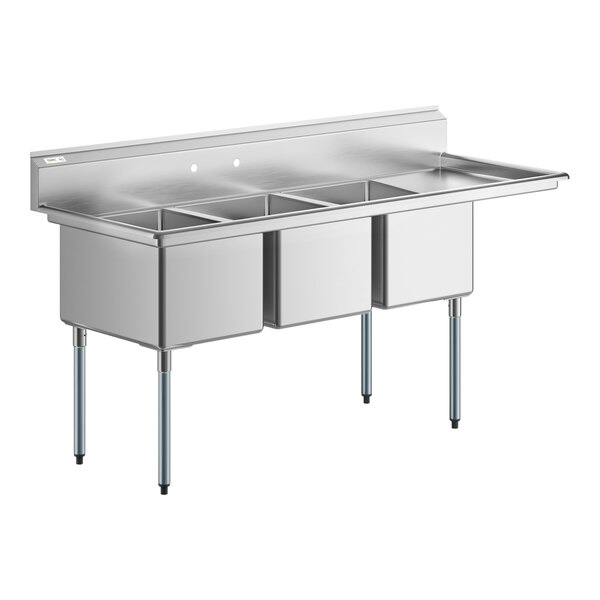 A Regency stainless steel three compartment sink with right drainboard.