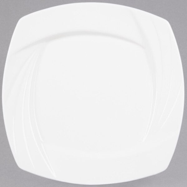 A CAC Garden State white square porcelain plate with a curved edge.