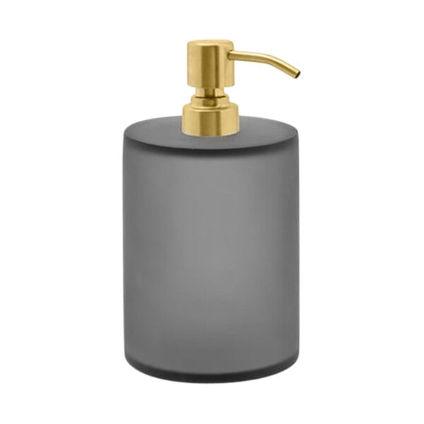 A close-up of a smoke grey Room360 soap dispenser with a matte brass pump top.