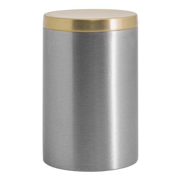 A silver stainless steel canister with a matte brass lid.