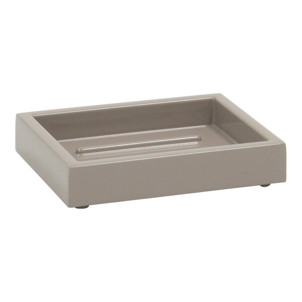 A grey rectangular stone soap dish with a handle.