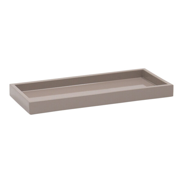 A Room360 New York beige stone resin rectangular amenity tray with a handle.