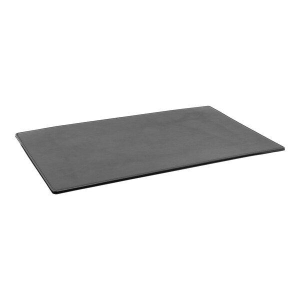 A black rectangular Room360 London faux leather desk pad on a white table.