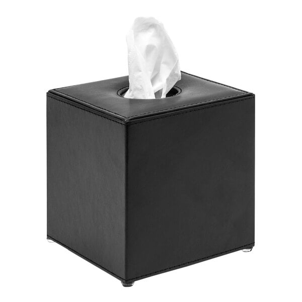 A black Room360 square tissue box cover with white tissue paper in it.