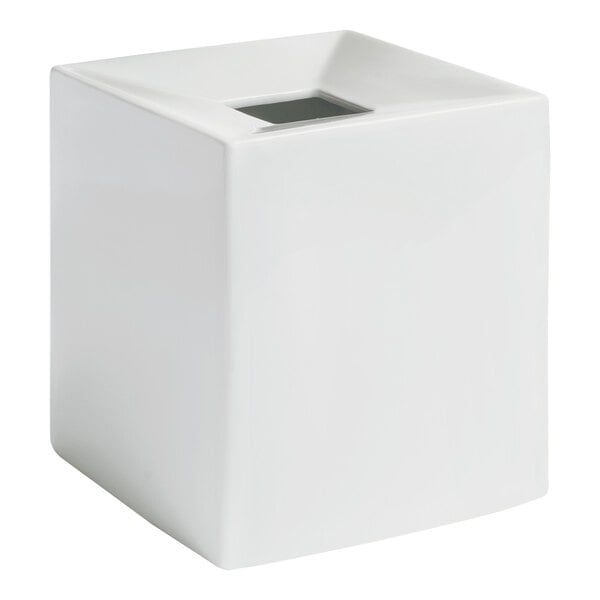 A white porcelain square tissue box cover with a hole in the top.