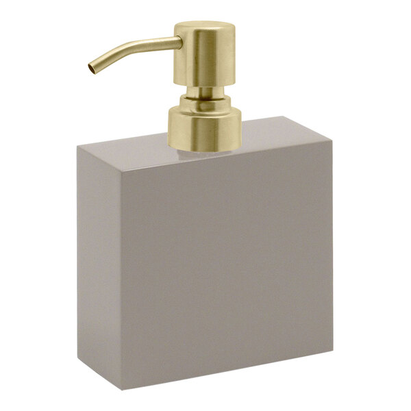 A Room360 New York stone soap dispenser with a matte brass pump top on a white background.
