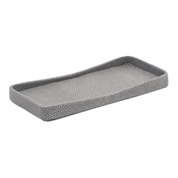 A grey rectangular Room360 Belize amenity tray with a faux shagreen texture.