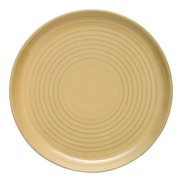 A tan terracotta coupe bowl with a spiral design on it.