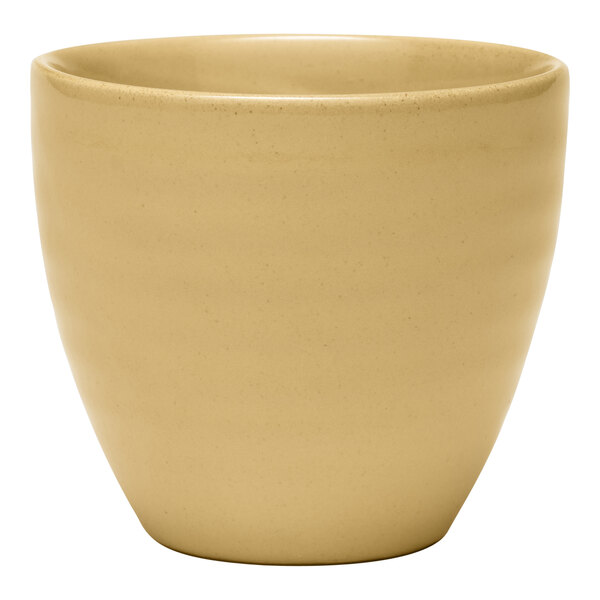 A Libbey tan terracotta bouillon bowl on a white surface.