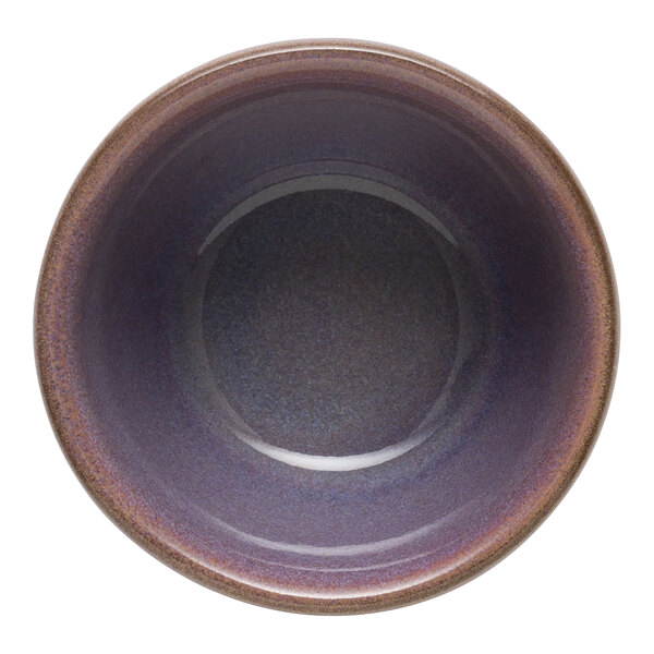 A purple stoneware bowl with a brown rim.