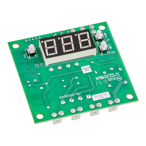 A green circuit board with a digital display.