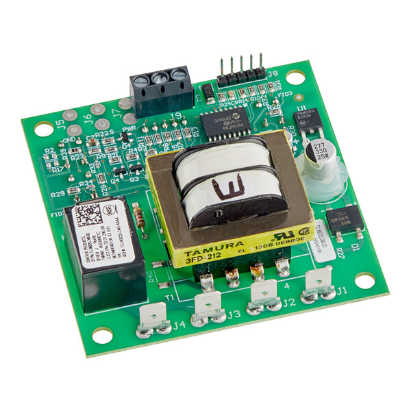 A green circuit board with a small electronic component and a black and yellow label.