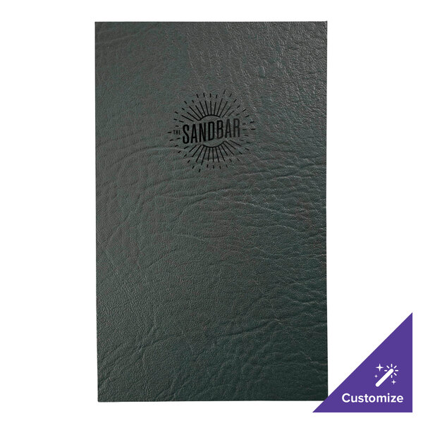 A green leather menu cover with a logo on a table.