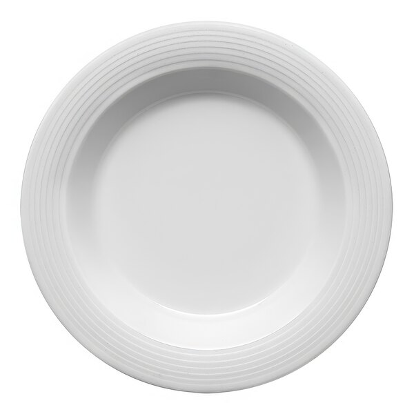 A Bauscher bright white porcelain plate with an embossed circular edge.