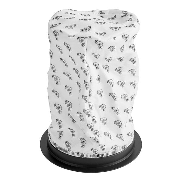A white fabric pod with black text and designs on it.