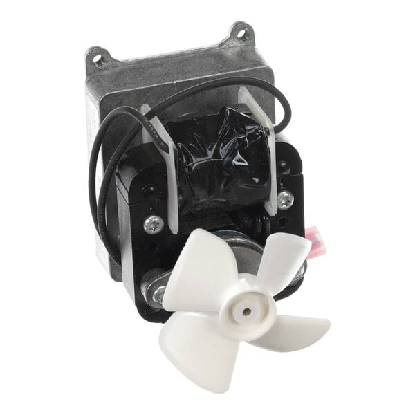 A small metal device with a white propeller.