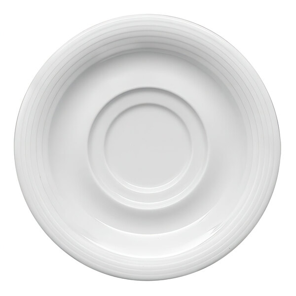 A close-up of a Bauscher bright white porcelain saucer with a circular design on the rim.