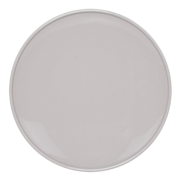 A Front of the House white porcelain plate with a round white border.
