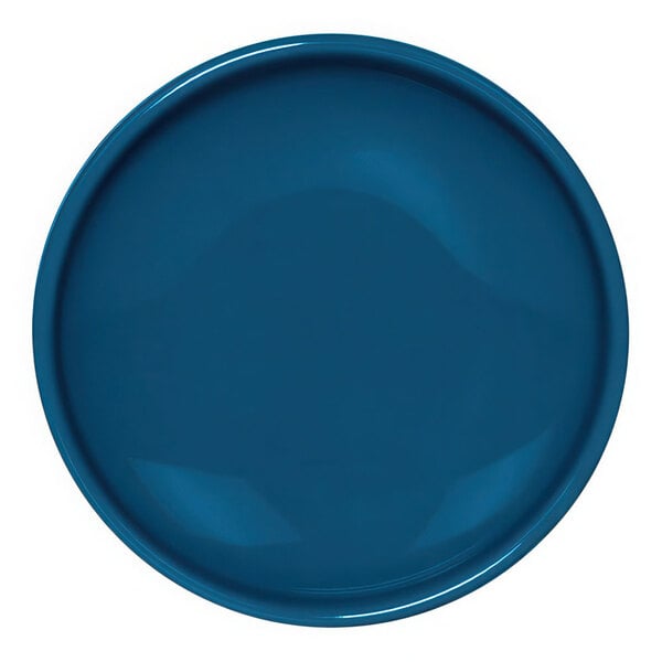 A blue plate with a white surface and a round white rim.