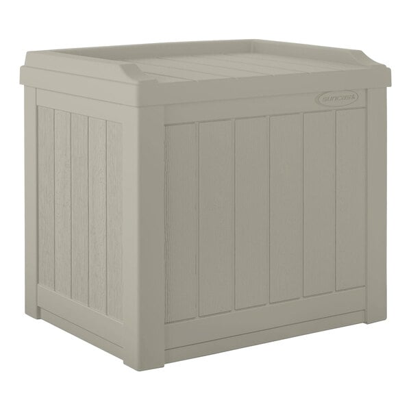 A Suncast light taupe resin storage box with a lid.