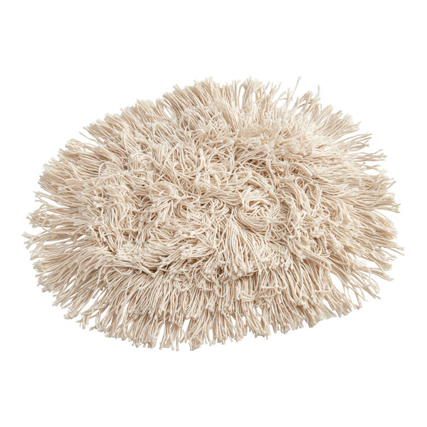 A close-up of a white shaggy rug with a Choice Natural Cotton Cut-End Wedge Dry Dust Mop Head attached to a mop handle.
