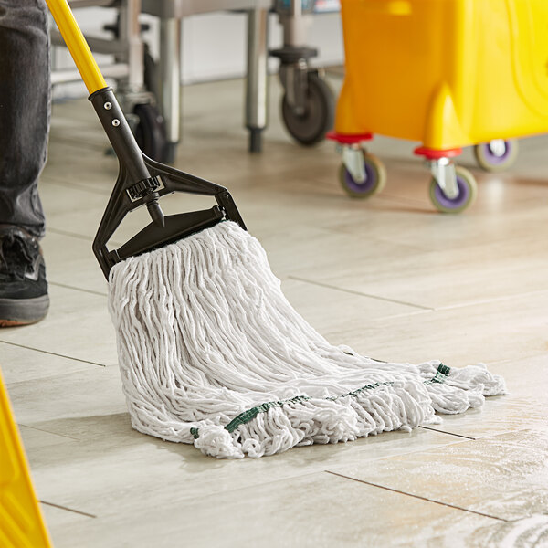 A person holding a Lavex Pro white rayon looped end mop.