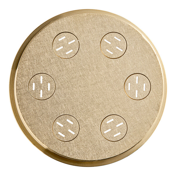 A circular gold plate with holes.