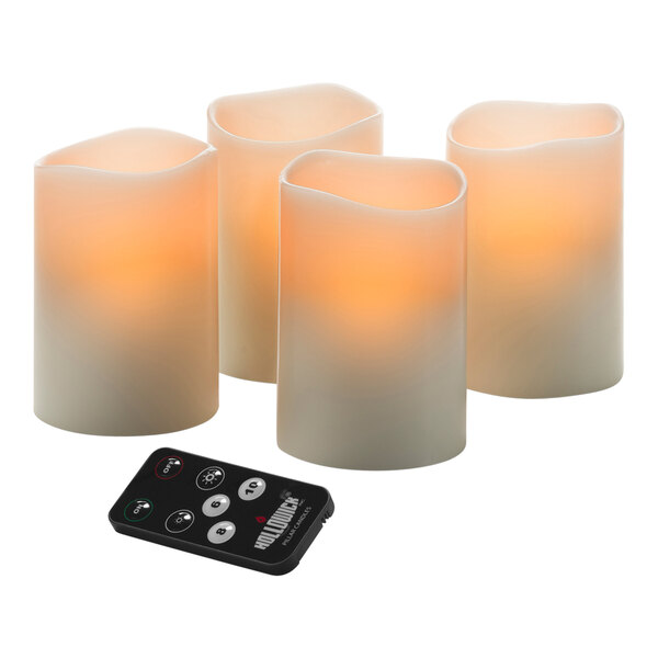 A group of 3 Hollowick LED wax pillars with a remote control.