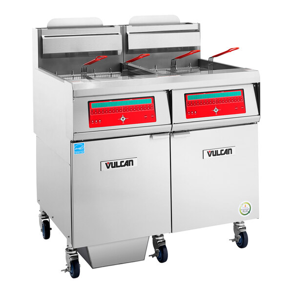 A commercial stainless steel floor fryer with four baskets, computer controls, and filtration system.
