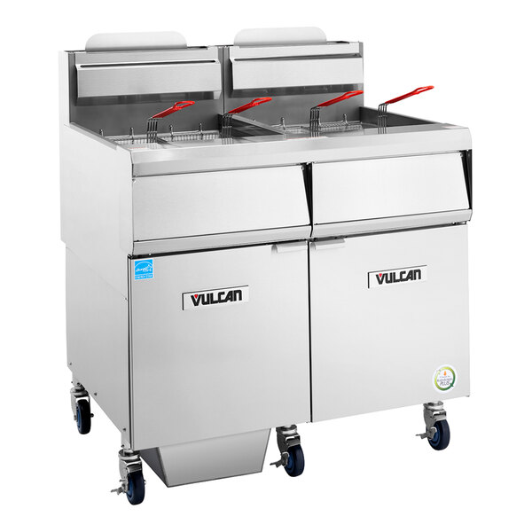 A large stainless steel commercial floor fryer with four frying baskets, analog controls, and filtration system, designed for high-capacity cooking.
