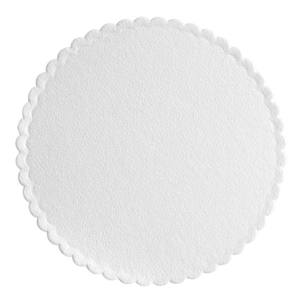 A white round paper coaster with scalloped edges.