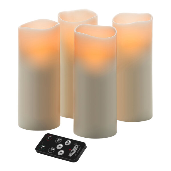 A group of Hollowick LED wax candles with a remote control.