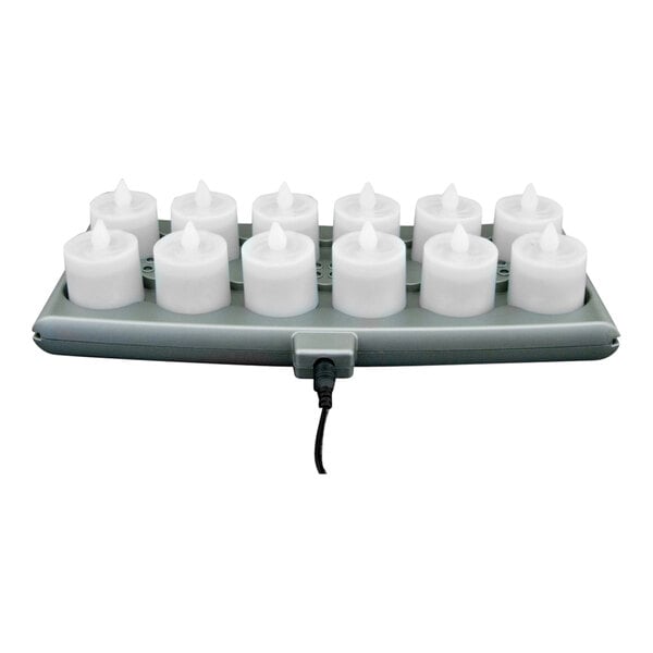 A group of clear Hollowick Platinum+ rechargeable flameless candles on a tray.