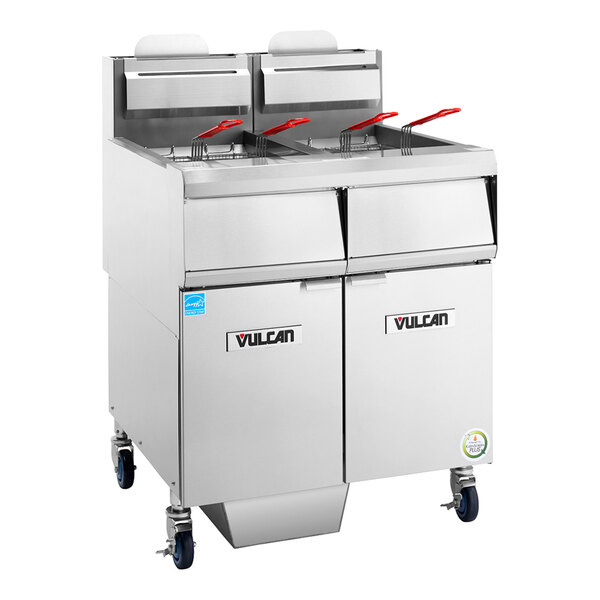 A commercial stainless steel floor fryer with four baskets and analog controls, designed for high-capacity frying.