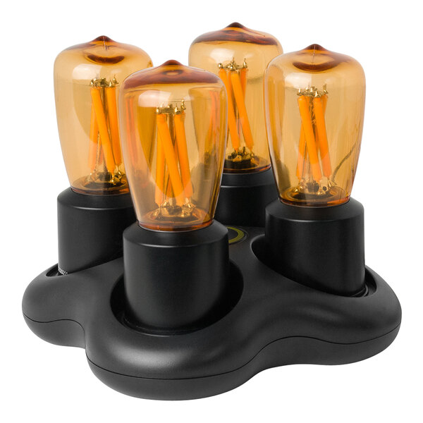 A black Hollowick Nexis light bulb holder with three orange Edison bulbs inside.