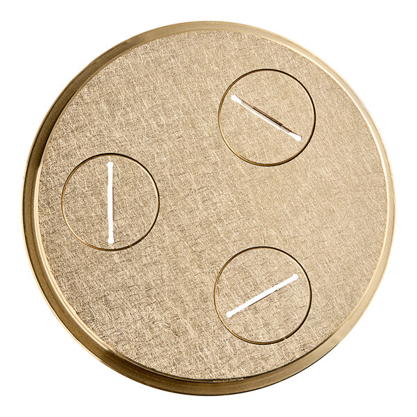 A circular gold plate with holes.