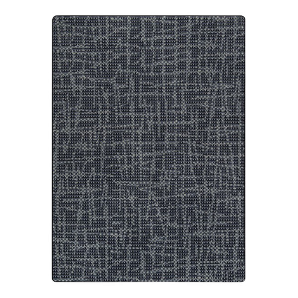 A close up of a slate grey area rug with a pattern.