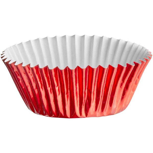 A red Enjay baking cup with a white liner.