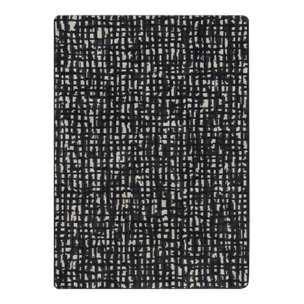 A close-up of the black and white grid pattern on a Joy Carpets Onyx area rug.
