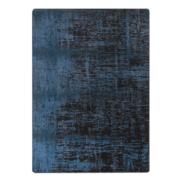 A close up of a blue and black Joy Carpets Kid Essentials Coastal Canvas area rug with a dark abstract design.