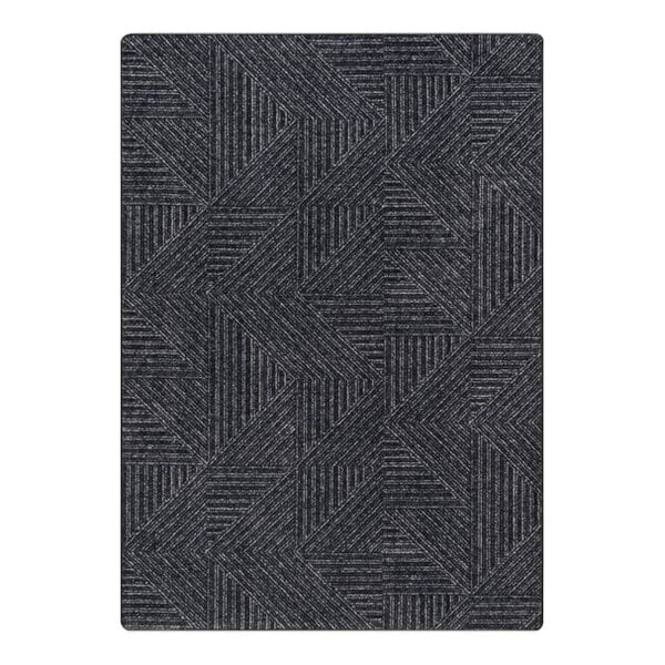 A close up of a Joy Carpets black and grey geometric patterned area rug.