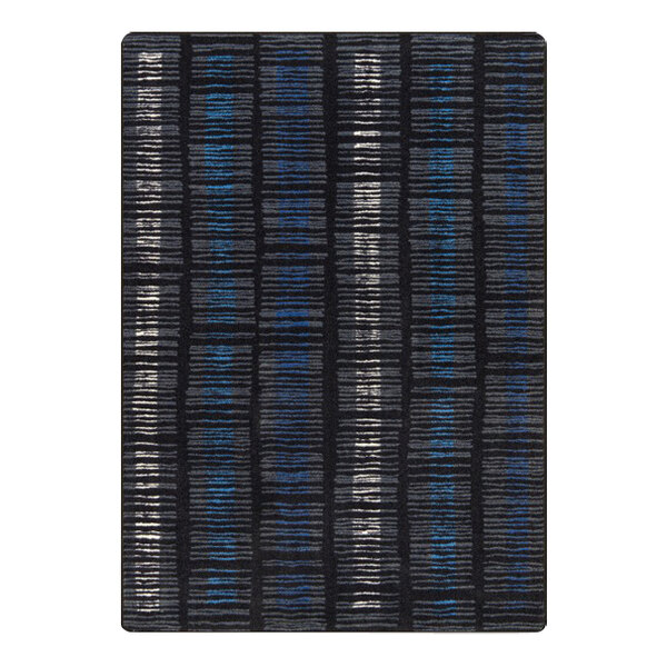 A close up of a black and blue Joy Carpets Kid Essentials Verve area rug with a pattern in sapphire blue.