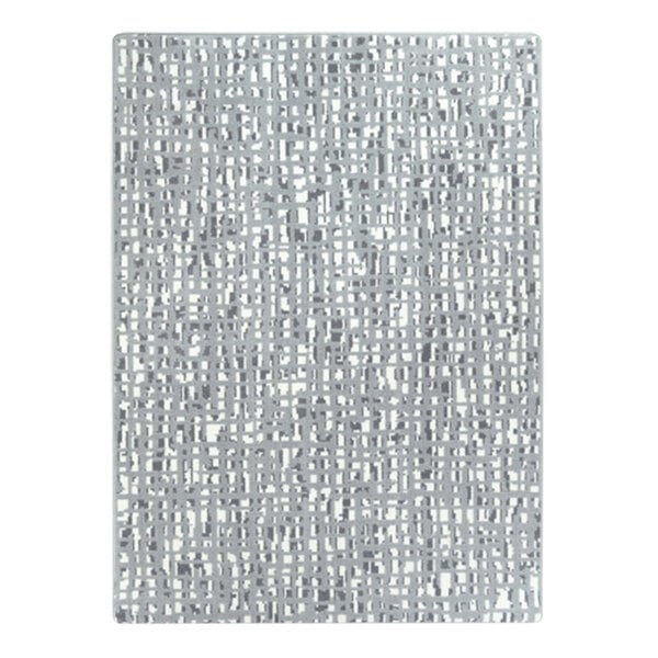 A close-up of a white and grey Joy Carpets Fool's Gold area rug with a grid pattern.