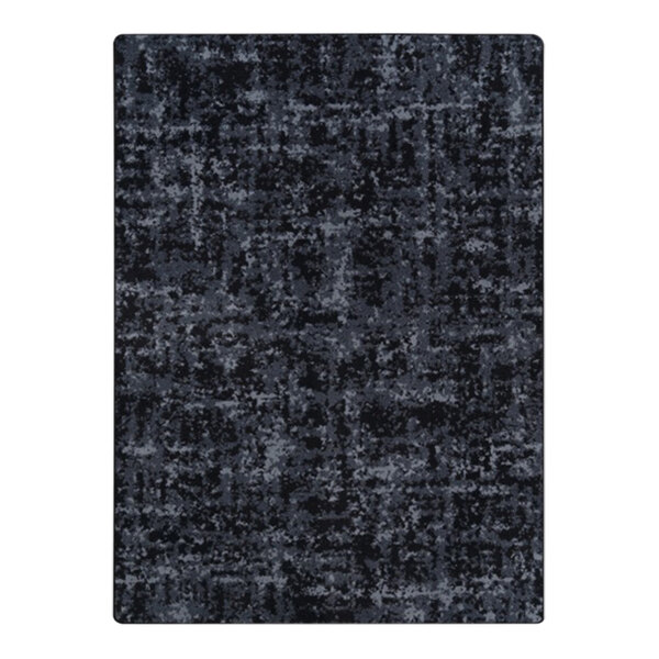 A close-up of a slate rectangular area rug with black and grey lines.