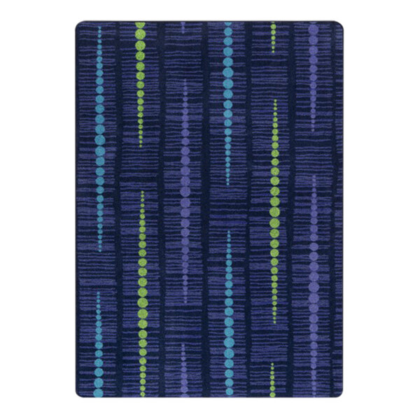 A close up of Joy Carpets Kid Essentials Recoil violet area rug with blue and green dots.