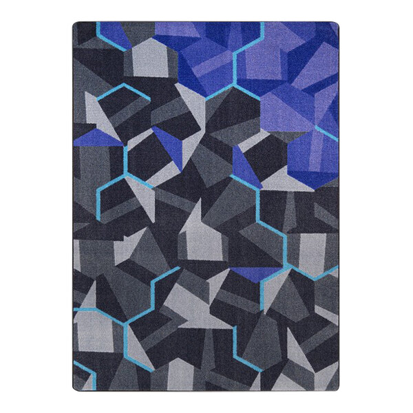 A close-up of the blue and black geometrical design on a Joy Carpets area rug.