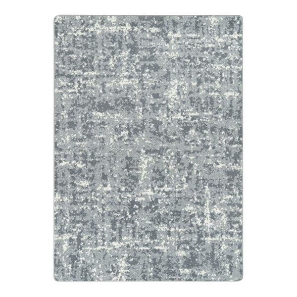 A close-up of a grey and white speckled surface on a Joy Carpets WorkSpace Cloudy area rug.