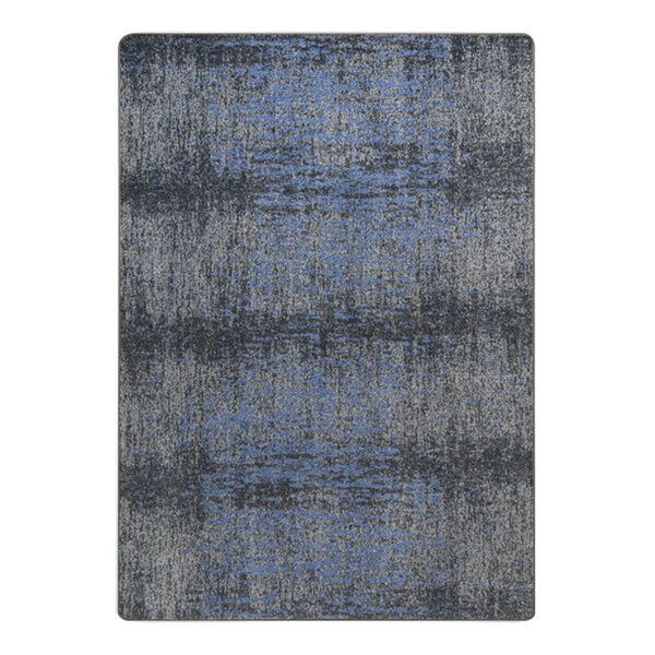 A close-up of a Joy Carpets Marine area rug with blue and grey stripes.