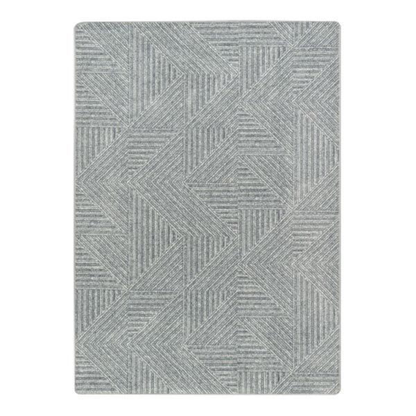 A close-up of the Joy Carpets Above Board area rug with grey and white geometric patterns.