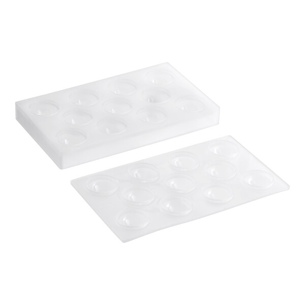 A close-up of a silicone mold with 11 sphere cavities.